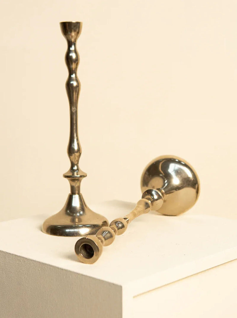 Vintage Italian candleholders with sleek design and metallic finish