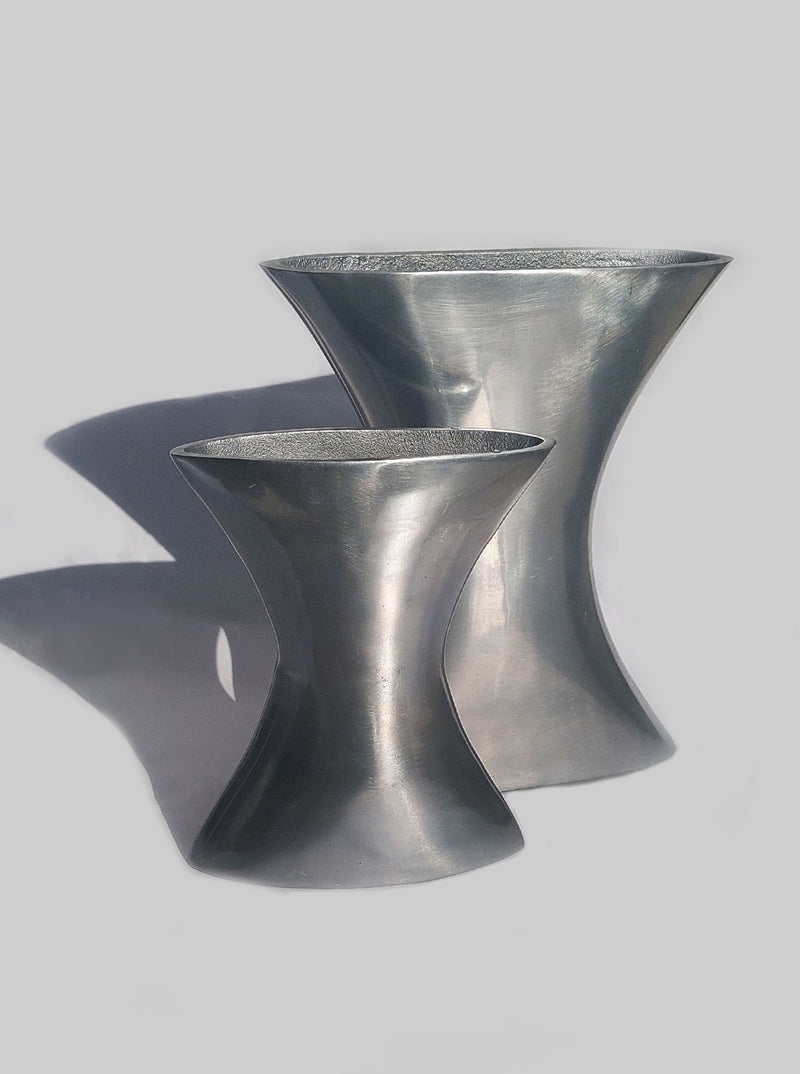 Two elegant handcrafted ceramic vases with intricate patterns and glossy finish