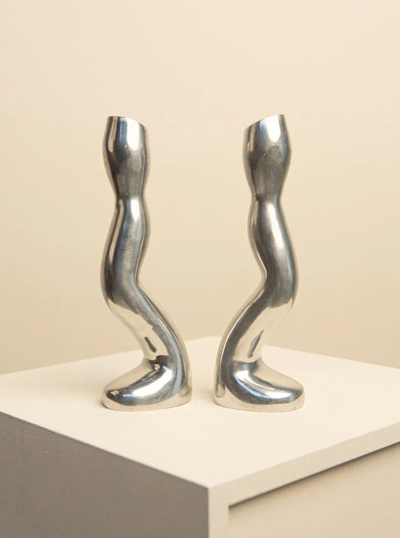 Two unique candleholders in cast aluminium with a biomorphic shape