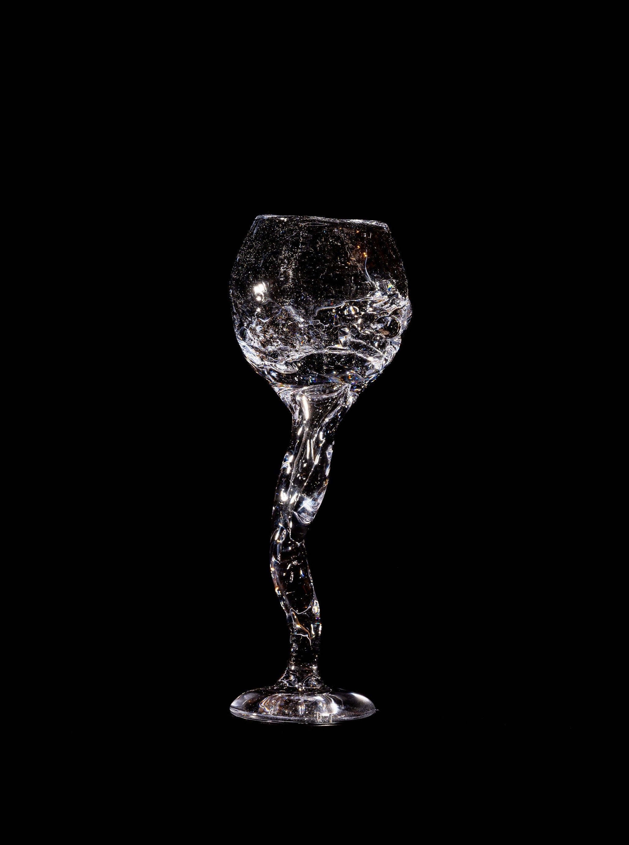  Hand-blown wine glass with a unique pattern of air bubbles, adding a touch of sophistication to any table setting