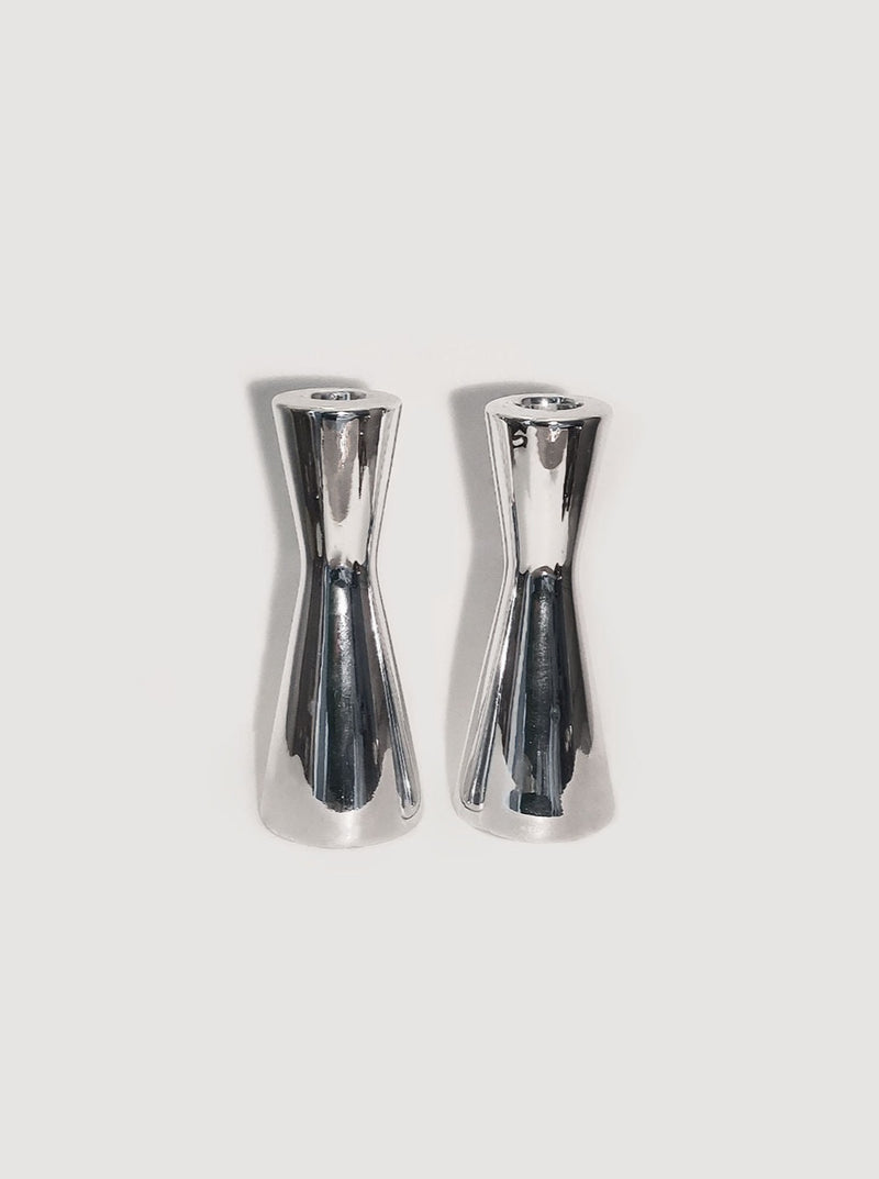 Beautiful pair of ceramic candle holders with a shiny silver finish