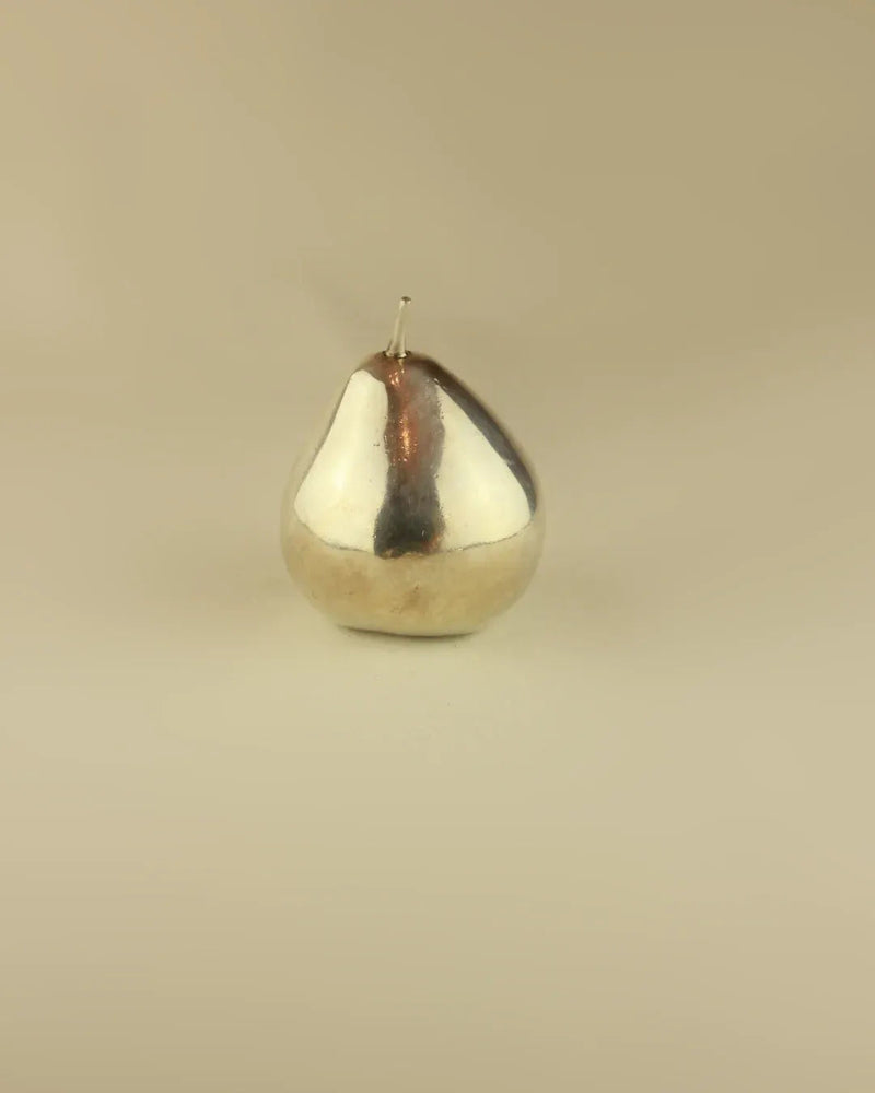 Elegant silver pear sculpture with a sleek and modern design
