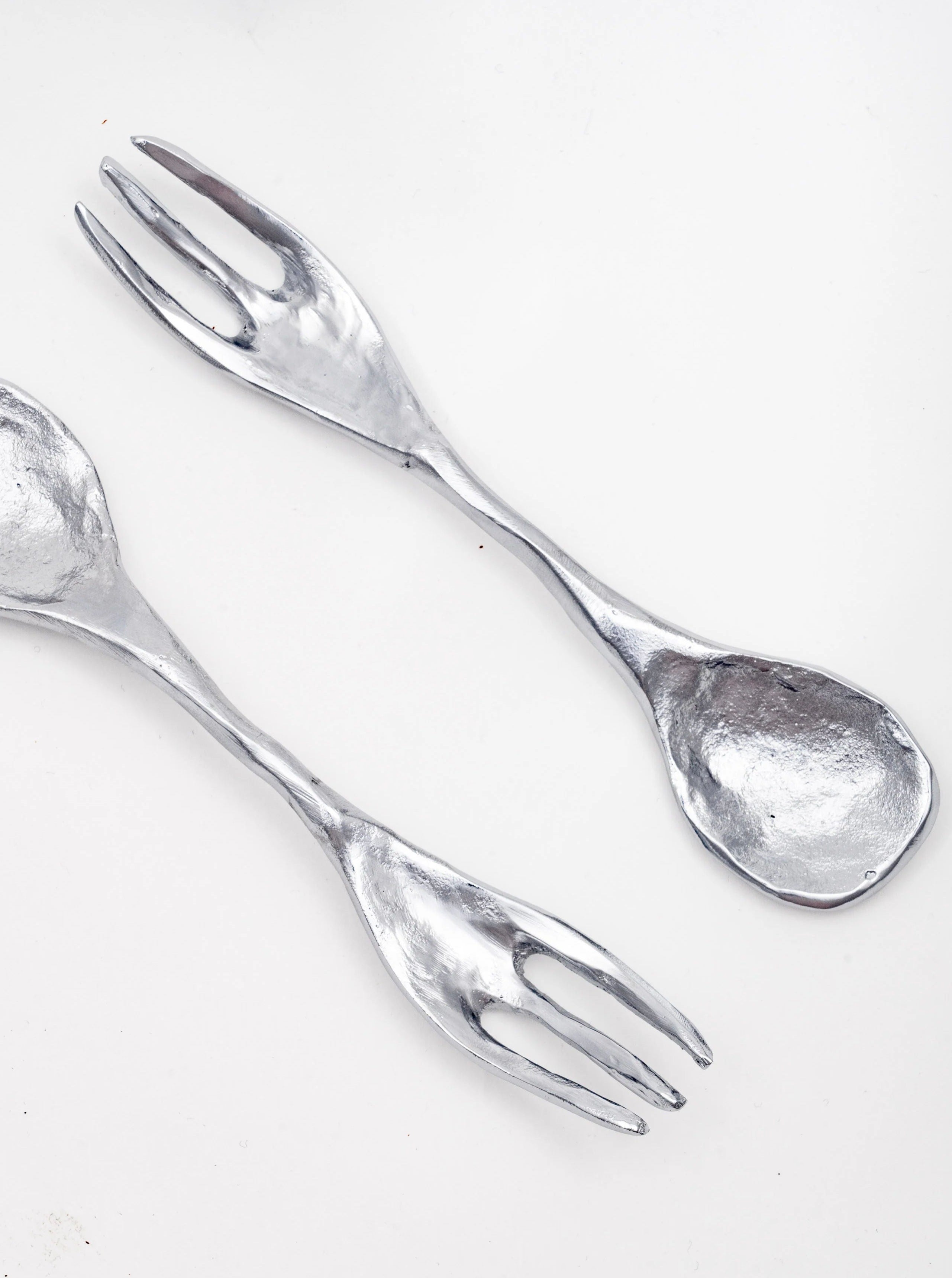  Beautifully crafted small spoons with ornate detailing for fine dining experiences