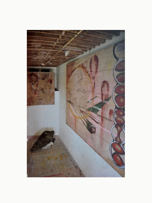 An art studio with a wall mural in progress, featuring a sketch of a human figure and abstract elements, reminiscent of Maison Plage's style. Tools and paint are visible, with an unfinished ceiling overhead.