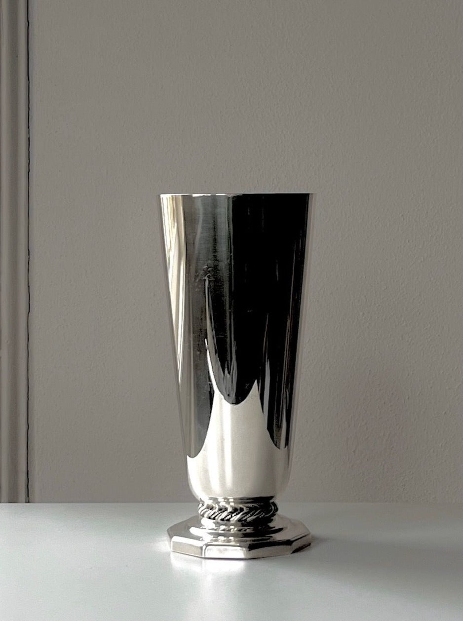 Tall and sleek art deco vase in silver with stunning ornate details and a vintage aesthetic
