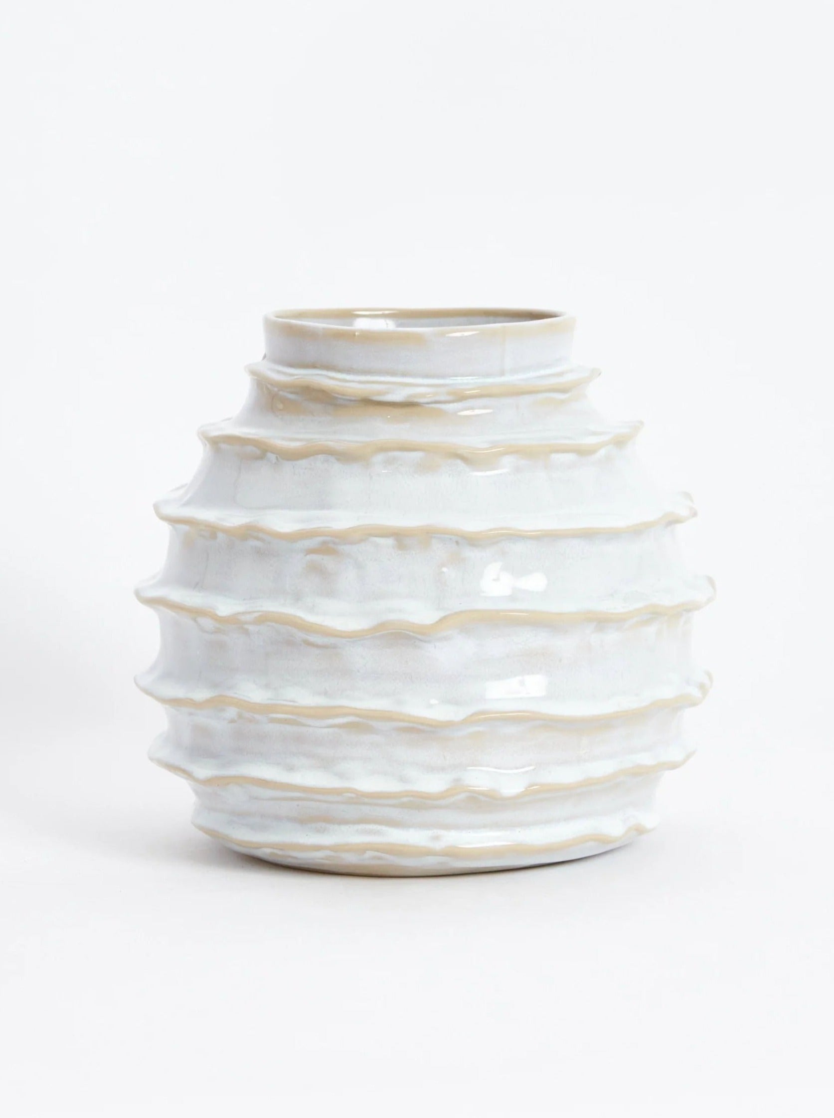 A Holiday Vase in Shiny White by Project 213A, featuring horizontal ridges, displayed against a plain white background. The vase has a rounded shape and a slightly narrowed opening at the top.