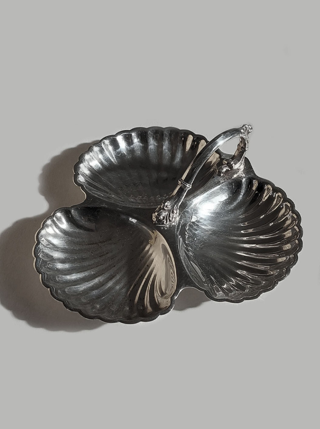 Silver-plated shell triple server with elegant design and three compartments for serving