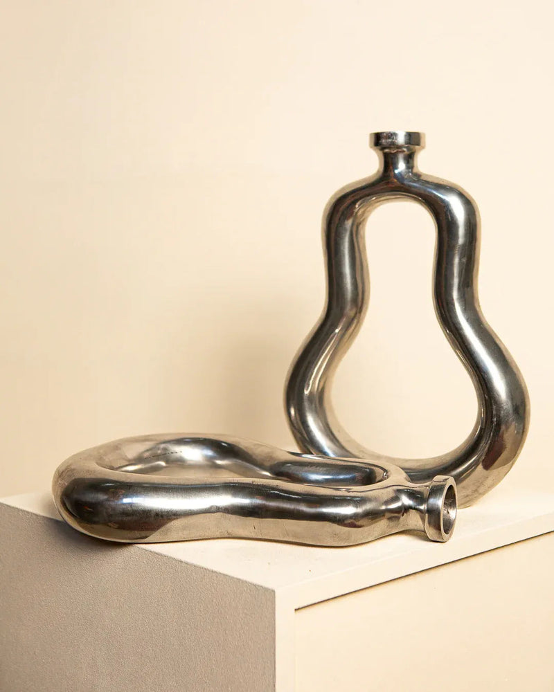 Vintage 80's style large candleholders in sleek metallic finish and intricate design