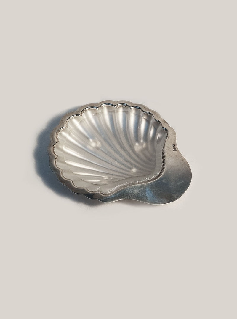 White ceramic shell-shaped butter dish with lid and delicate scalloped edges