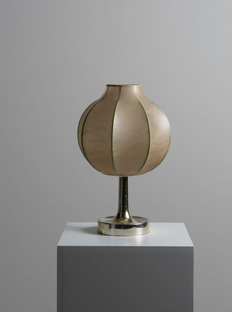 Modern and elegant Cocoon Table Lamp with a sleek design and soft ambient lighting
