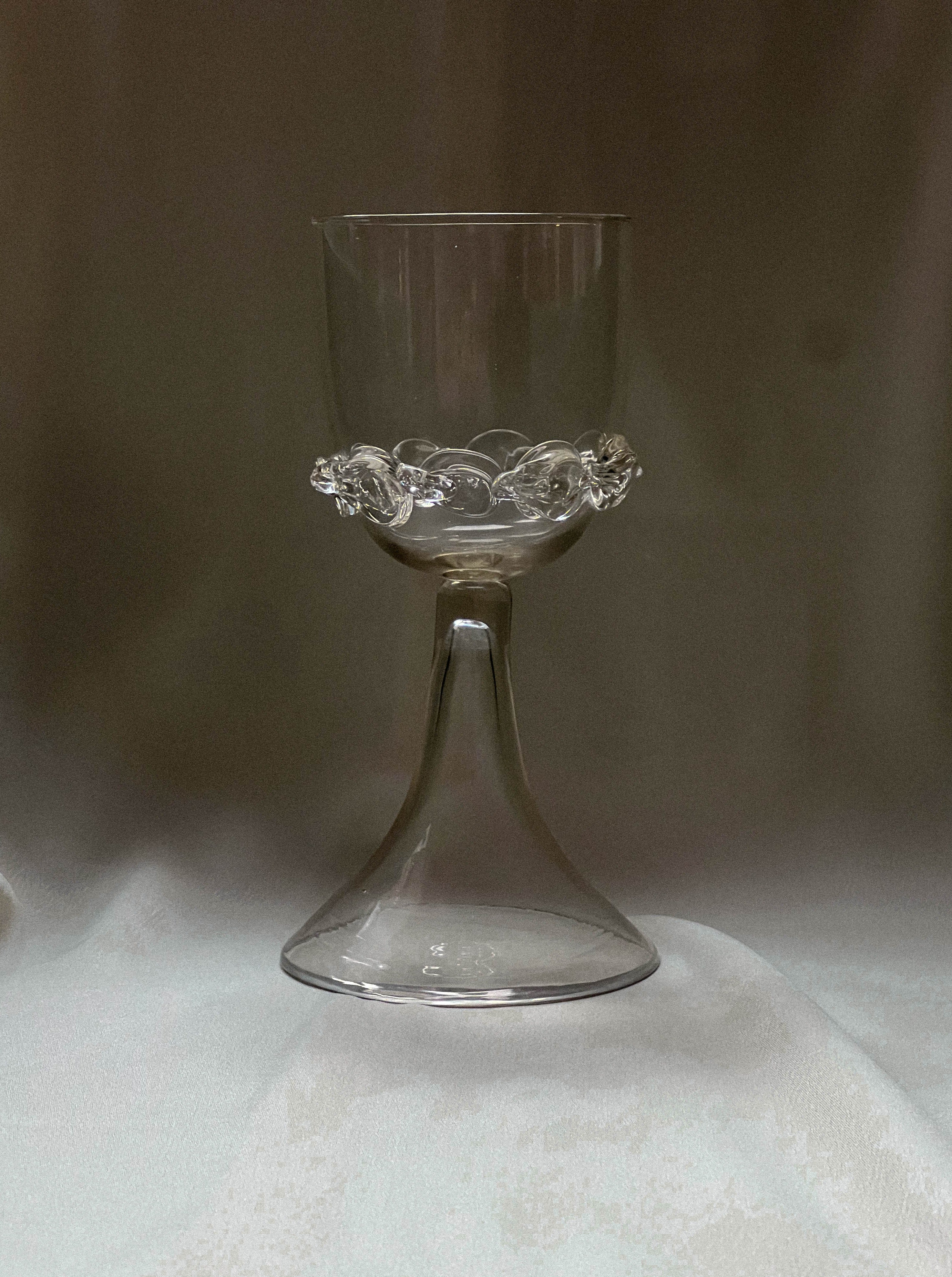 Handcrafted wine glasses with intricate chain detail