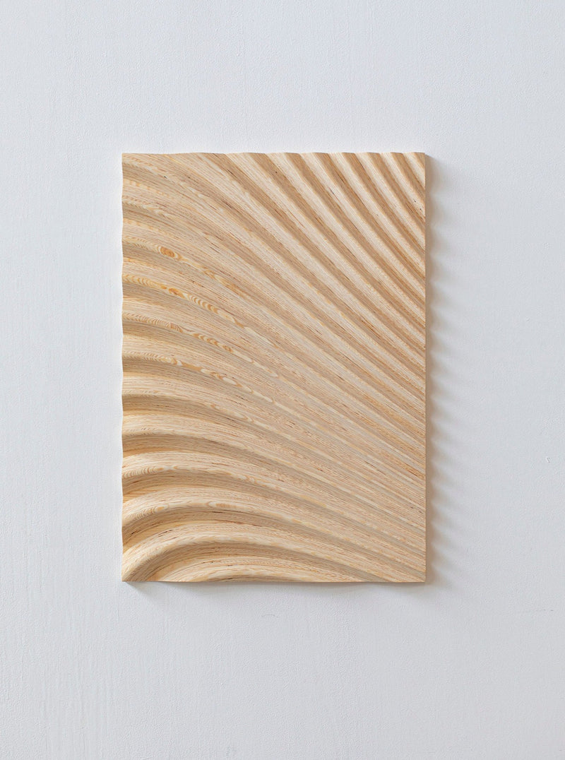 Wave Naturel by Studio Arno Hoogland is a handcrafted, light wood piece featuring smooth, wave-like grooves radiating from the lower left corner, creating an artistic ripple effect that embodies minimalist aesthetics, perfect for luxury interiors.