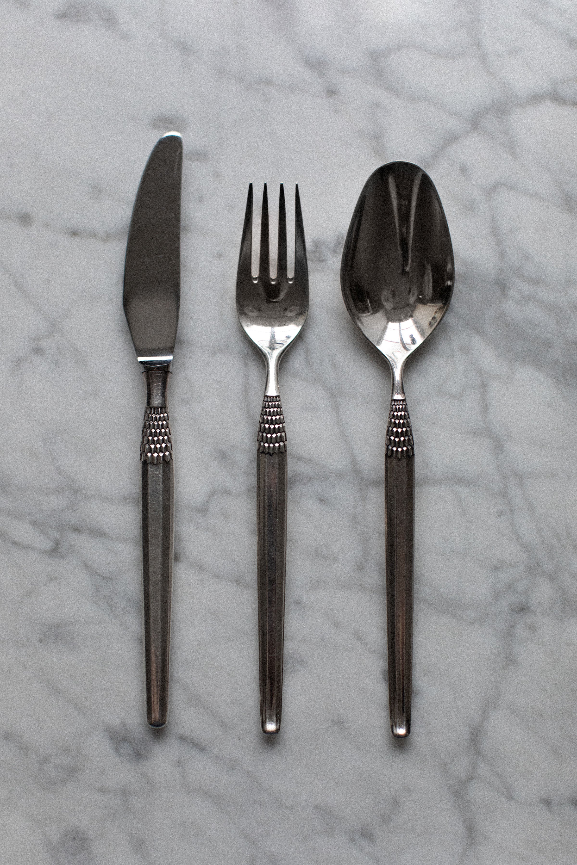 Top view of Art Deco Cutlery set capturing the opulent and artistic details