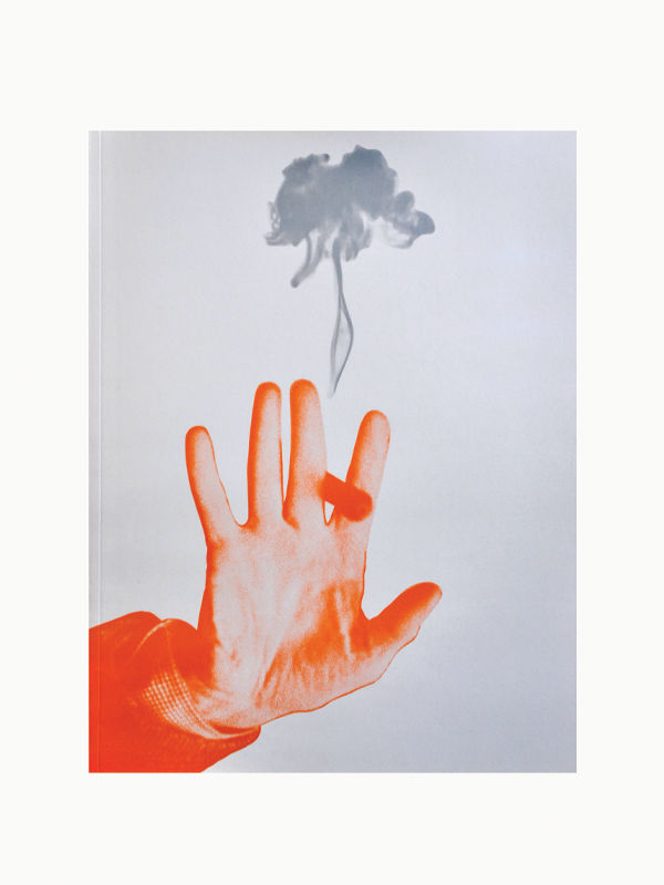 An image with a white background showcasing an artistic hand in vibrant orange tones, delicately holding a small cigarette between its fingers. Above the hand, smoke gracefully ascends. This stylized and creative image is perfect for enhancing your interior design or book stack arrangement with "The Orange Set of 3 Interior Design and Art Books" by Maison Plage.