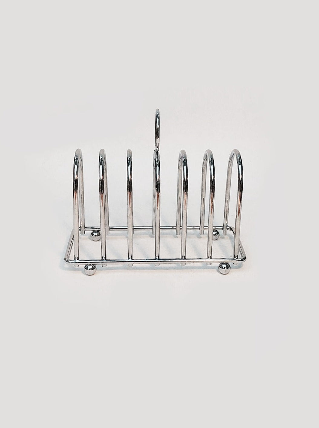 Elegant Art Deco Toast Rack featuring a stylish handle and decorative base