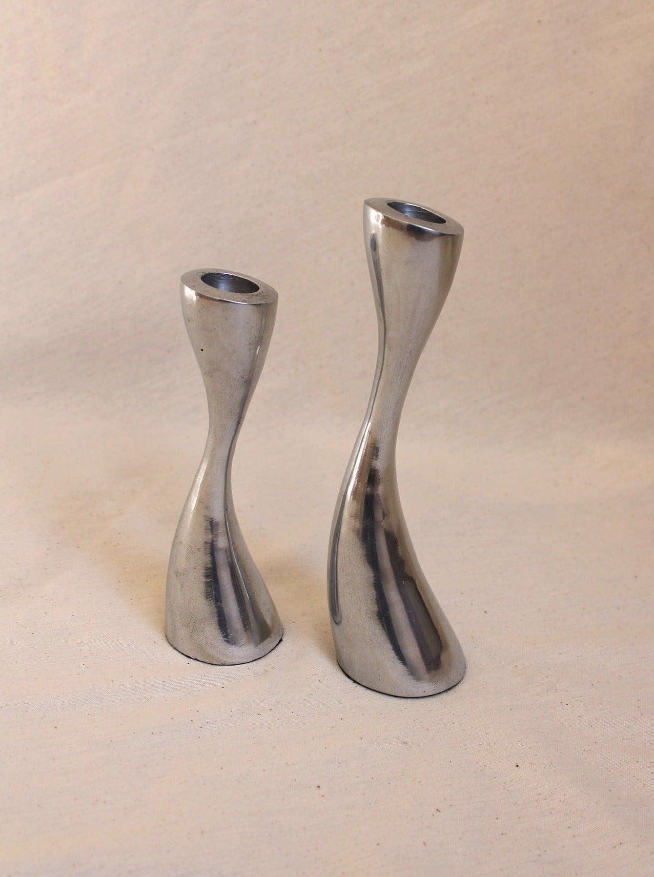  Group of curvy black candleholders in different sizes and shapes