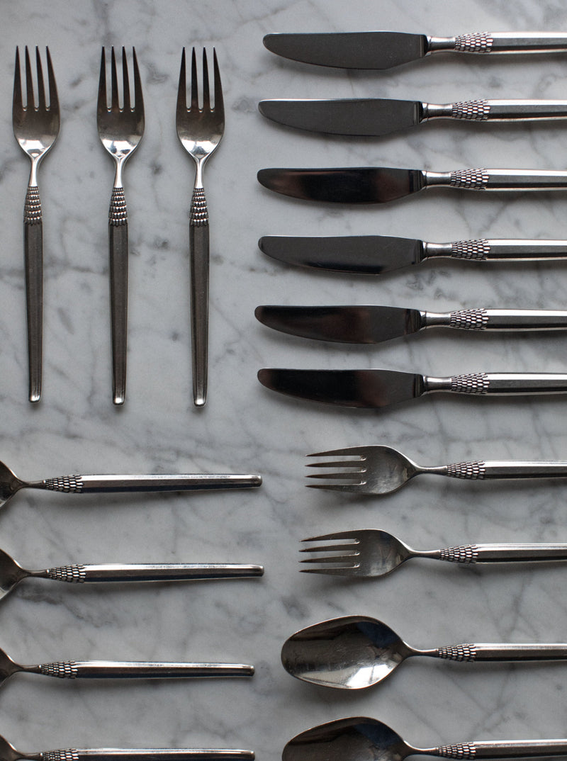 Art Deco Cutlery featuring sleek, geometric handles and elegant silver finish
