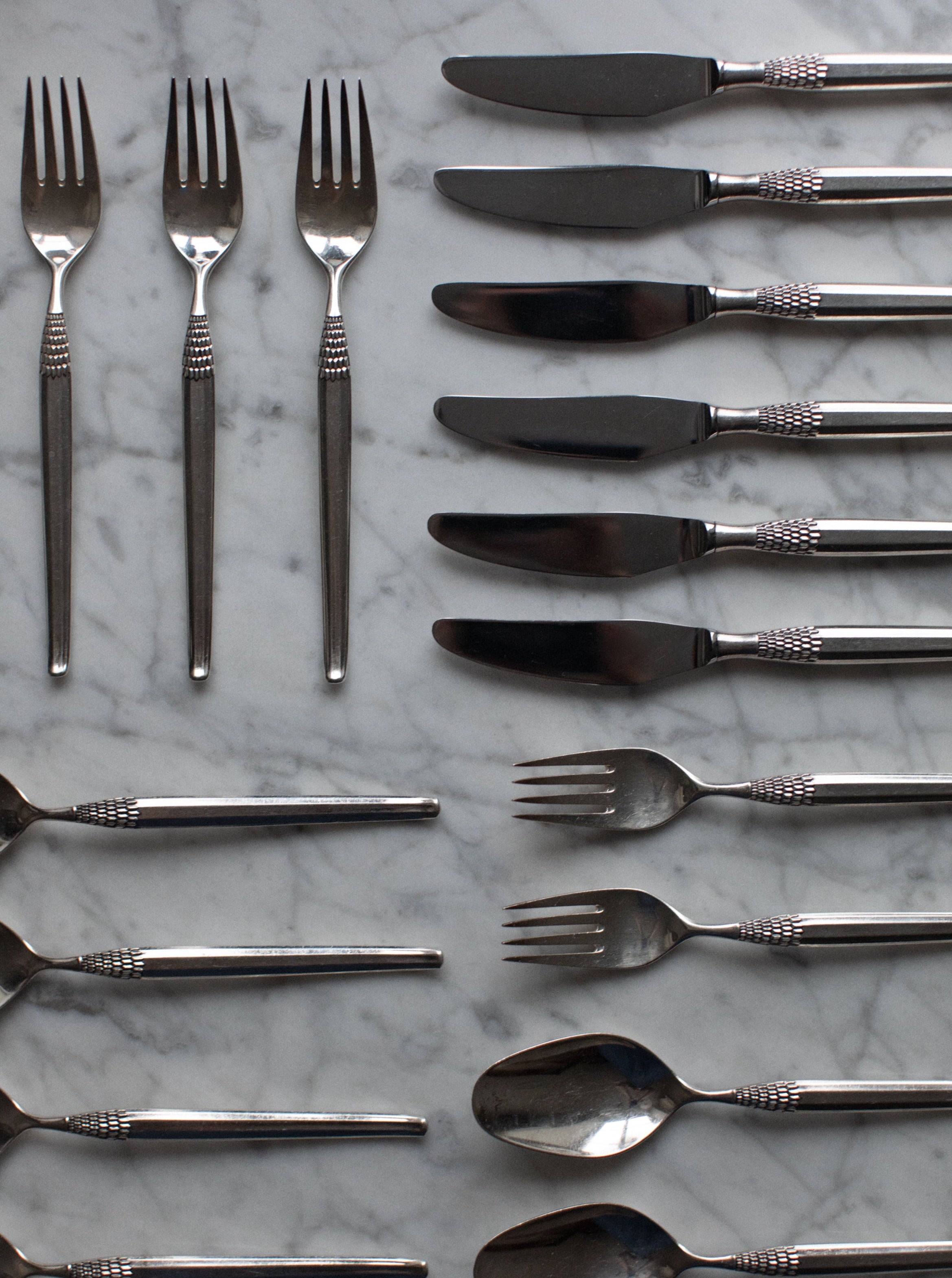 Art Deco Cutlery featuring sleek, geometric handles and elegant silver finish