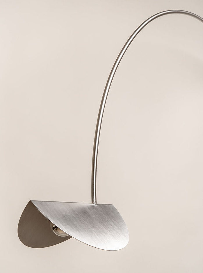  Art deco inspired wall light with geometric design and polished nickel finish