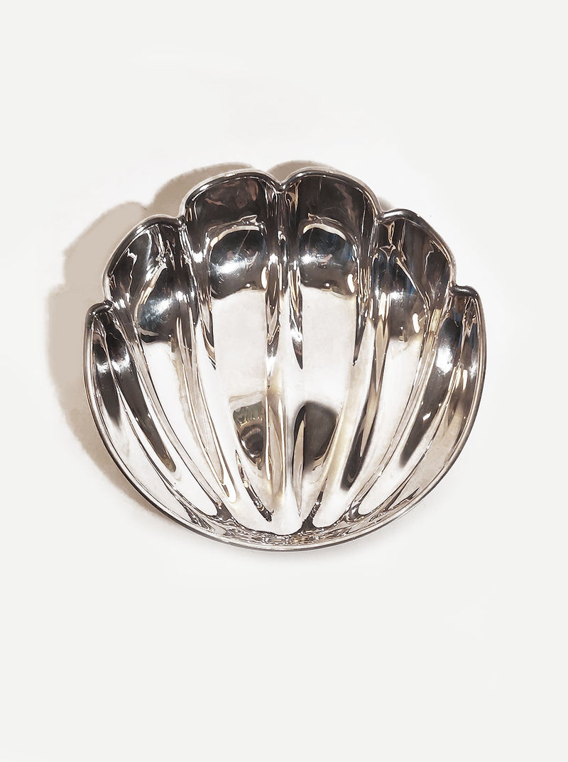 Beautiful handcrafted medium shell dish made of durable ceramic material with intricate details and a glossy finish