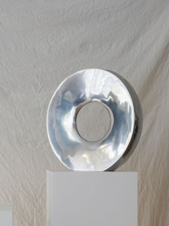 Large round glass vase with a wide opening, perfect for holding a bouquet of flowers or decorative branches