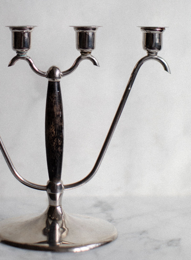  Tall, elegant candleholder made of polished chrome and rich wood